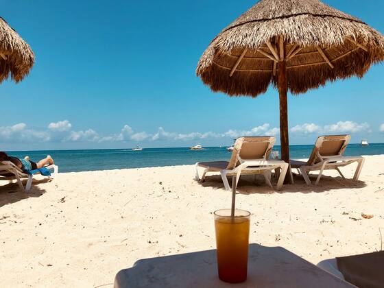 Beach umbrella and sun loungers
